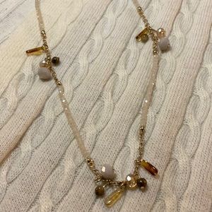 Loft necklace with dangling beads.